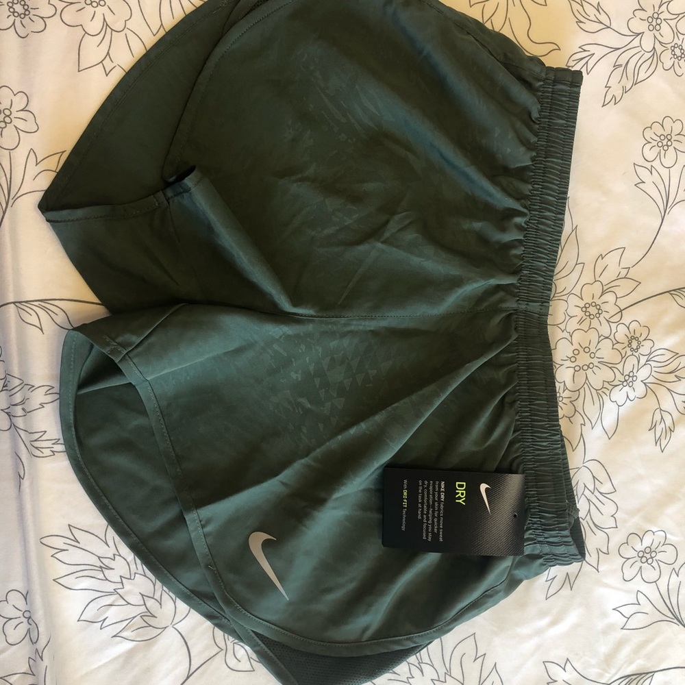 Army green Nike running shorts